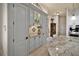 Kitchen with gray custom cabinets, granite countertops, decorative backsplash, and stainless appliances at 5944 Lake Melrose Dr, Orlando, FL 32829