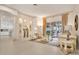 Comfortable living room with stylish decor, tiled floors, and seamless access to outdoor spaces at 5944 Lake Melrose Dr, Orlando, FL 32829