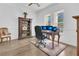 Bright office space with wood floors, large windows, and a handsome built-in bookshelf at 5944 Lake Melrose Dr, Orlando, FL 32829