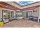 Inviting covered patio with ceiling fans, a bar area, and comfortable lounge seating at 5944 Lake Melrose Dr, Orlando, FL 32829