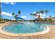 A large community pool is shown with palm trees, cabanas, and plenty of seating at 5944 Lake Melrose Dr, Orlando, FL 32829