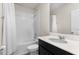 Bathroom showcasing a tub with a shower and a large vanity at 601 Watusi Way, St Cloud, FL 34772