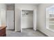 Bedroom featuring a closet with open doors and a window with blinds at 601 Watusi Way, St Cloud, FL 34772