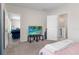 Comfortable bedroom with neutral tones and easy access to the living area and en-suite bathroom at 601 Watusi Way, St Cloud, FL 34772