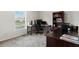 This bedroom features a desk with computer monitors, a bookcase, and carpet floors at 601 Watusi Way, St Cloud, FL 34772