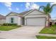 Charming single-story home with a two-car garage and well-maintained lawn at 601 Watusi Way, St Cloud, FL 34772