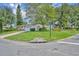 Well-maintained single-story home with a brick driveway, mature trees, and manicured landscaping on a corner lot at 604 Ponca Trl, Maitland, FL 32751
