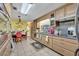 Well-lit kitchen with wooden cabinetry, granite countertops, and tile flooring, offering style and functionality at 604 Ponca Trl, Maitland, FL 32751