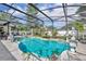 The pool area features a screened enclosure, elegant statues, landscaping, and a tranquil waterfall for outdoor enjoyment at 604 Ponca Trl, Maitland, FL 32751