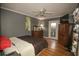 Bedroom with hardwood floors, a ceiling fan, and plenty of space for a comfortable layout at 610 Heatherton Vlg # 610, Altamonte Springs, FL 32714