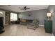 Inviting living room with tile floors, comfortable gray sectional, and bright natural light at 610 Heatherton Vlg # 610, Altamonte Springs, FL 32714