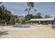 Community pool area with a hot tub, ample seating, and lush landscaping at 610 Heatherton Vlg # 610, Altamonte Springs, FL 32714