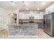 Well-equipped kitchen with stainless steel appliances and a center island at 7184 Enchanted Lake Dr, Winter Garden, FL 34787