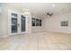 Large living room with tile floors, lots of light, and french doors at 7184 Enchanted Lake Dr, Winter Garden, FL 34787