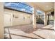 Enclosed patio with brick floors and string lights at 7184 Enchanted Lake Dr, Winter Garden, FL 34787