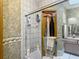 A patterned bathroom featuring a bathtub-shower combo and a single vanity at 750 Sw 91St Pl, Ocala, FL 34476
