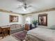 A cozy bedroom with carpet, warm lighting, and stylish decor at 750 Sw 91St Pl, Ocala, FL 34476