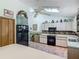 Bright kitchen featuring appliances, cabinetry, and tiled floor at 750 Sw 91St Pl, Ocala, FL 34476