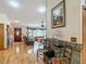 Open living room with hardwood floors, comfortable seating, and view of outdoor area at 750 Sw 91St Pl, Ocala, FL 34476