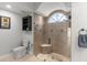 Bathroom featuring a glass-enclosed shower and tiled walls at 801 Hunt Dr, Lake Wales, FL 33853