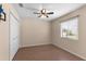 Bedroom featuring a ceiling fan, wood-look floors and window at 801 Hunt Dr, Lake Wales, FL 33853