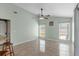 Light-filled dining area with vaulted ceilings, tile floors, and large windows overlooking the yard at 801 Hunt Dr, Lake Wales, FL 33853