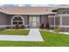 Close-up of the front entrance, featuring manicured landscaping and a well-lit walkway at 801 Hunt Dr, Lake Wales, FL 33853