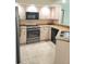 Traditional kitchen with tile floors, granite countertops and white cabinets at 801 Hunt Dr, Lake Wales, FL 33853