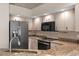 Well-appointed kitchen featuring granite countertops, stainless steel appliances, and recessed lighting at 801 Hunt Dr, Lake Wales, FL 33853