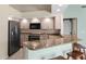 Modern kitchen featuring granite countertops, stainless steel appliances, and ample cabinet space at 801 Hunt Dr, Lake Wales, FL 33853