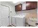 Bright laundry room with updated washer and dryer at 801 Hunt Dr, Lake Wales, FL 33853