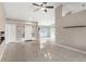 Open-concept space showcasing the entry, living room with its tiled floor, and natural light at 801 Hunt Dr, Lake Wales, FL 33853