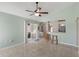 Open living space featuring tile flooring, bar seating, and sliding glass doors to the outdoor patio at 801 Hunt Dr, Lake Wales, FL 33853