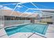 Refreshing in-ground pool surrounded by a screened enclosure for ultimate privacy and enjoyment at 801 Hunt Dr, Lake Wales, FL 33853