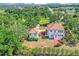 Aerial view shows the home with a detached garage, lush landscaping, and a spacious backyard at 802 S 10Th St, Haines City, FL 33844