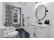 Chic bathroom featuring modern fixtures, black and white accents, and a stylish vanity with storage at 802 S 10Th St, Haines City, FL 33844