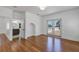 Bright bedroom featuring hardwood floors, natural light, and ensuite bathroom access at 802 S 10Th St, Haines City, FL 33844