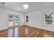 Spacious bedroom with hardwood floors, natural light, and access to an outdoor deck at 802 S 10Th St, Haines City, FL 33844