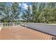 Expansive deck with picturesque views of lush trees and serene landscape at 802 S 10Th St, Haines City, FL 33844