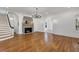 Elegant living room with hardwood floors, a statement fireplace, and staircase with dark railing at 802 S 10Th St, Haines City, FL 33844