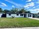 Charming single-story home with fresh exterior paint and a well-manicured lawn on a sunny day at 804 Starke Lake Cir, Ocoee, FL 34761