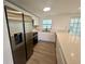 Well-lit kitchen featuring stainless steel appliances, granite countertops, and white cabinetry at 804 Starke Lake Cir, Ocoee, FL 34761
