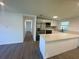 Bright, updated kitchen with stainless steel appliances, quartz countertops, and an island with seating at 804 Starke Lake Cir, Ocoee, FL 34761