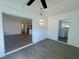 Open living space with modern flooring, and an open view of the kitchen and laundry area at 804 Starke Lake Cir, Ocoee, FL 34761