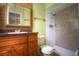 Bathroom featuring brown vanity and walk-in shower with colorful, patterned tile at 916 Great Bend Rd, Altamonte Springs, FL 32714