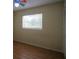 Bedroom featuring light walls, laminate floors, and a large window with blinds at 916 Great Bend Rd, Altamonte Springs, FL 32714