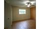 Bright bedroom featuring a ceiling fan, light walls, and wood-look laminate flooring at 916 Great Bend Rd, Altamonte Springs, FL 32714