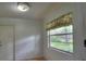 Breakfast nook with a view of the backyard through a window, featuring a light floral curtain at 916 Great Bend Rd, Altamonte Springs, FL 32714