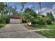 Charming single-story home with a stone facade, mature trees, and a well-maintained front yard at 916 Great Bend Rd, Altamonte Springs, FL 32714