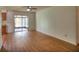 Open-concept living area featuring laminate flooring and sliding glass doors to the screened in porch at 916 Great Bend Rd, Altamonte Springs, FL 32714